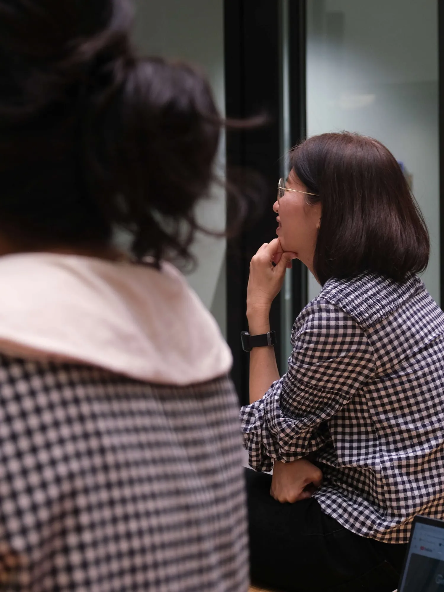 An attendee listens during the Q&A.